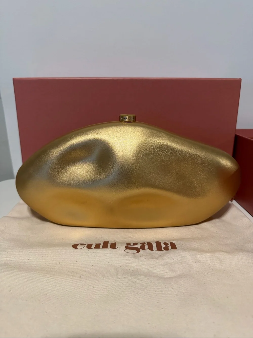 Cult Gaia The Caldera Clutch in Matte Brass